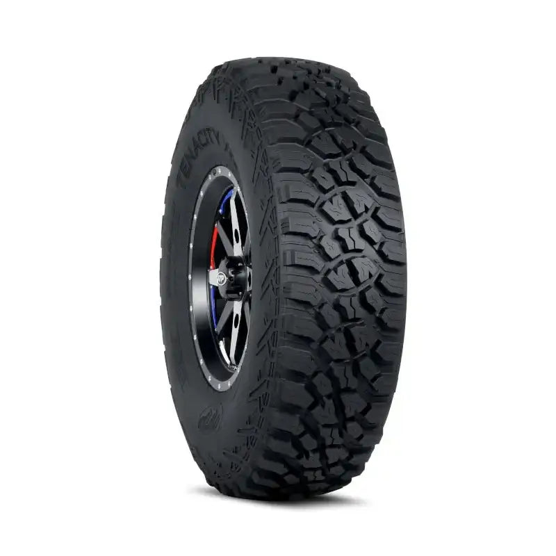 Atv Dekk 32x10-15 Itp Tenacity Xnr, skrå forfra med grovt mønster og felgdetaljer i sort, sølv og rød/blå.