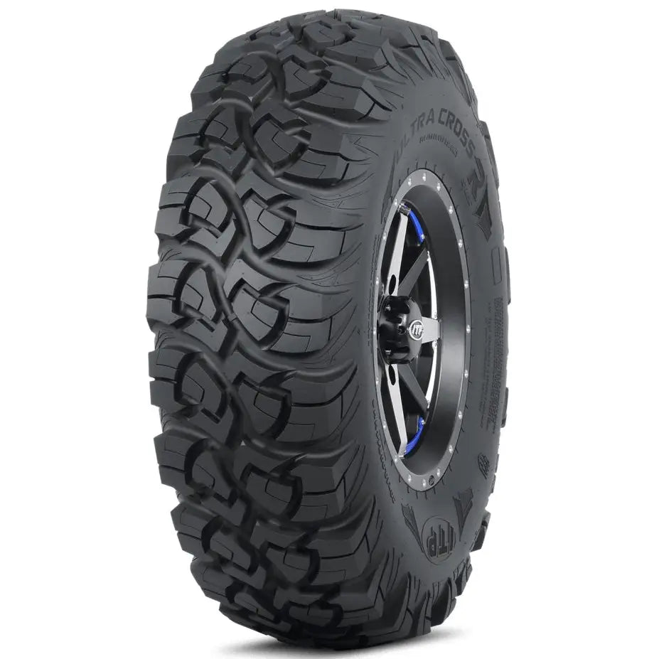 Atv Dekk 29x11-14 ITP UltraCross i trekvart vinkel, viser grovt mønster, metallfelg og blå detaljer ved navet.