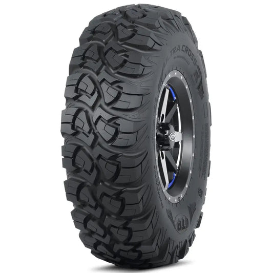 Atv Dekk 29x11-14 ITP UltraCross i trekvart vinkel, viser grovt mønster, metallfelg og blå detaljer ved navet.