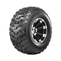 Atv Dekk 18x10.5 Journey, skrå sidevisning som fremhever brede knaster, grovt mønster og sølvdetaljer på felgen.