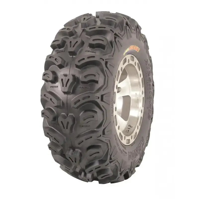 Atv Dekk 27x11R12 Kenda Bear Claw, skråvisning som fremhever grov profil og delvis synlig sølvfelg.